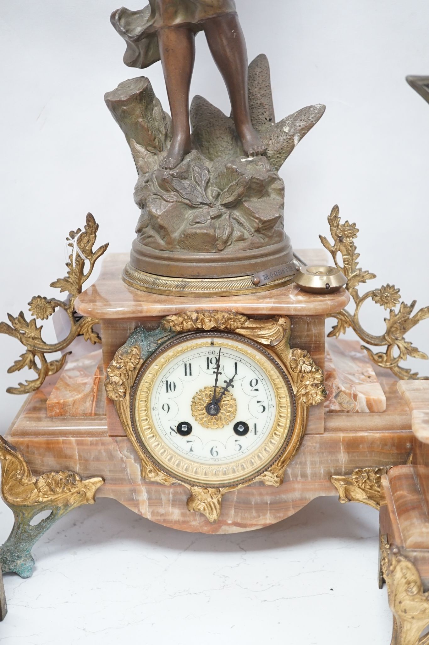 A French onyx and spelter figural clock garniture 66cm